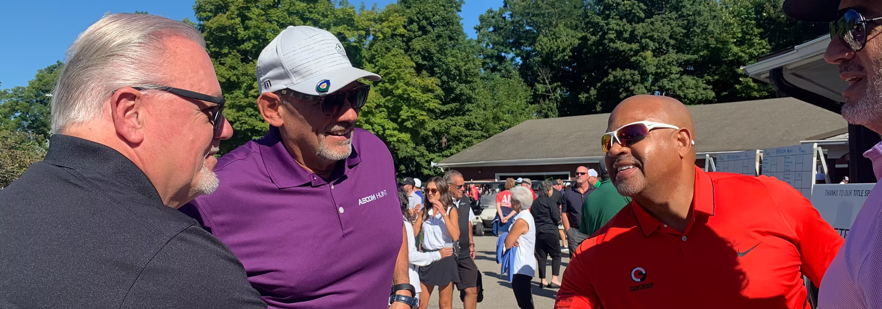 Steve Corbitt networking with AECOM Hunt and industry partners at a golf event